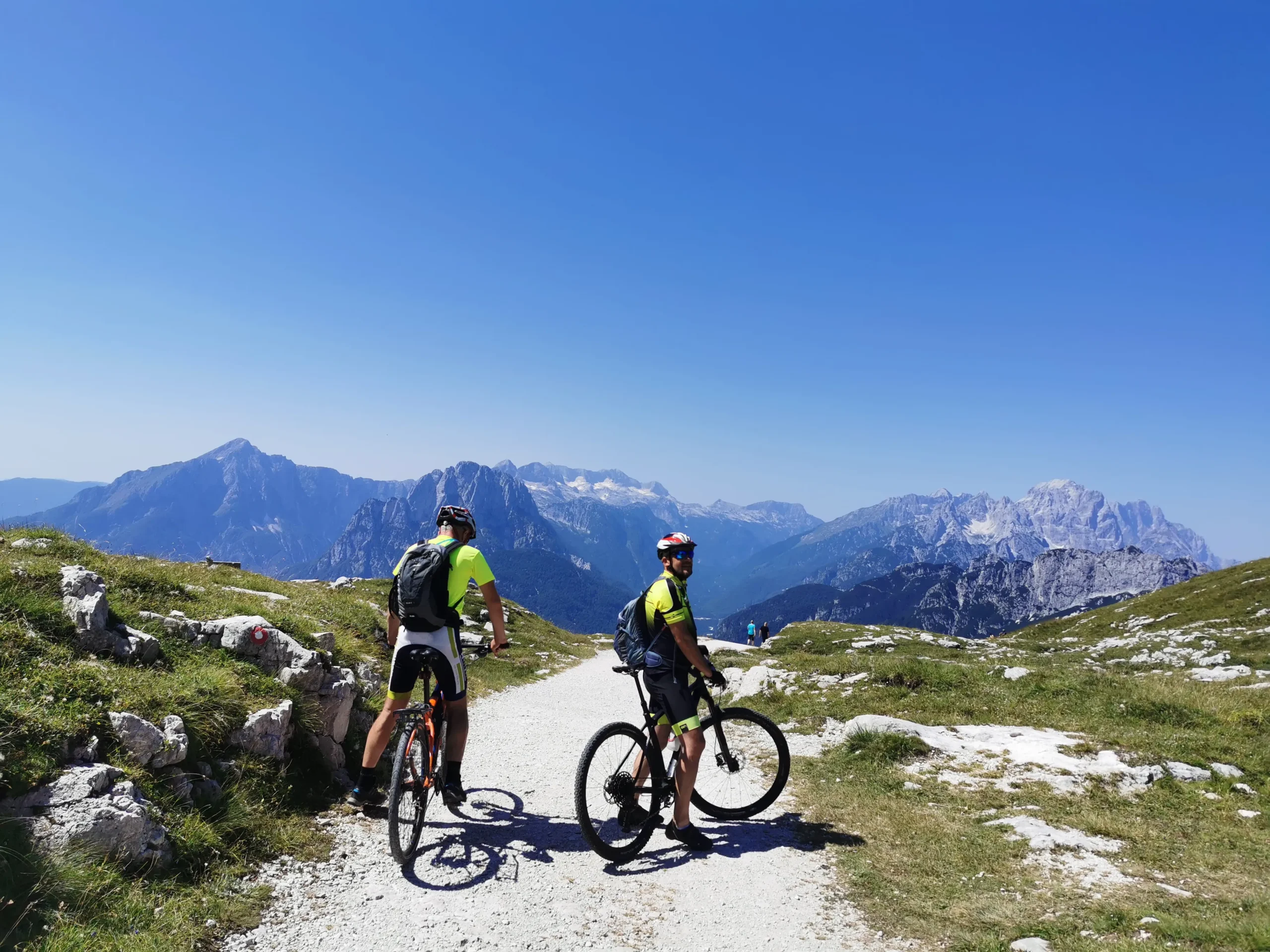 Cycling Slovenia Cyclists in mountain route in Slovenia in Soča valley