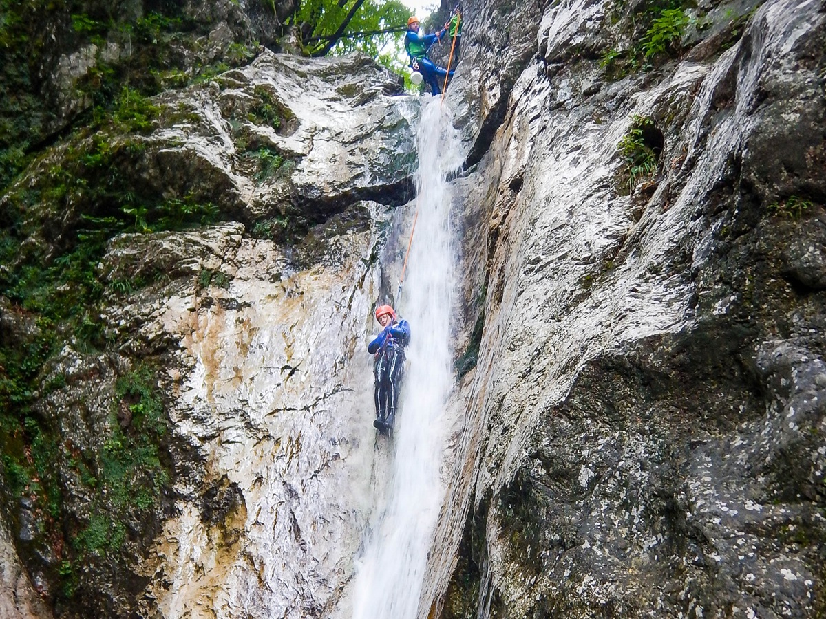 Canyoning waterfall descent Soča Valley